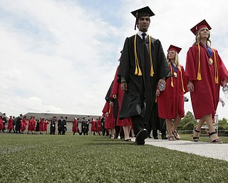       .         ROBERT  K. YOSAY | THE VINDICATOR..Canfield High School Seniors march onto the field at the start of the graduation..Canfield High School Graduation on the football field in Canfield..-30-