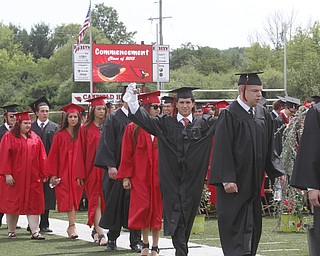       .         ROBERT  K. YOSAY | THE VINDICATOR..Canfield High School Seniors march onto the field at the start of the graduation..Canfield High School Graduation on the football field in Canfield..-30-
