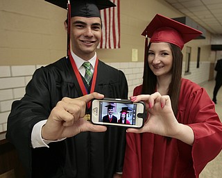       .         ROBERT  K. YOSAY | THE VINDICATOR..ready for the ceremony double trouble is  Kyle Anderson and Bridget Griffin ..Canfield High School Graduation on the football field in Canfield..-30-
