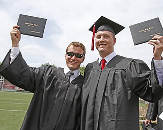       .         ROBERT  K. YOSAY | THE VINDICATOR..proud graduates as Carson Kesner and  Jordan Brown.. show off their diplomas..Canfield High School Graduation on the football field in Canfield..-30-