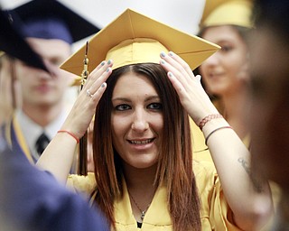 William D Lewis The Vindicator Lowellville grad Josie Floraadjusts her cap before commencement Sunday at Lowellville HS.