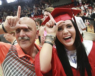 William D Lewis the Vindicator Struthers grad Rebekah Dragus and her grandfather Paul Lisko signal to family members in hte audience at end of Sunday commencement ceremony.
