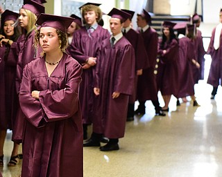 BOARDMAN, OHIO - JUNE 7, 2015: Alyssa Danzo waits in the back hall way before being allowed to enter the gym for the commencement ceremony Sunday afternoon at Boardman High School. (Photo by David Dermer/Youngstown Vindicator)