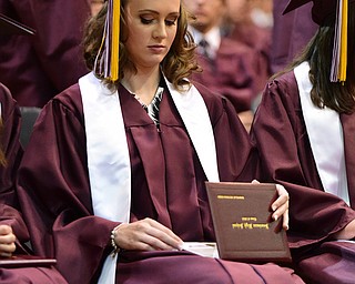 BOARDMAN, OHIO - JUNE 7, 2015: Gabrielle Rossi checks out her diploma after being one of the first to receive it during the Boardman High School commencement ceremony Sunday Afternoon at Boardman High School. (Photo by David Dermer/Youngstown Vindicator)