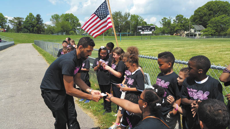SPECIAL TO THE VINDICATOR
The Rotary Club of Youngstown hosted its third annual Rockin’ Race for Cancer with students from Harding Elementary School on May 27 at The Rayen Stadium. Proceeds of more than $1,700 will support the Joanie Abdu Comprehensive Breast Care Center of Mercy Health and was presented to Dr. Rashid Abdu, founder of the center, and Jonathon Fauvie. special events/data manager of Mercy Health Foundation. Co-chairmen for the event were Tiffany Westbay, Louis Lee and Carol Sherman. Above, Lee gives free passes for OH WOW! to the top two fundraisers in each third, fourth, fifth and sixth-grade class from Harding. The passes were donated by OH WOW!
