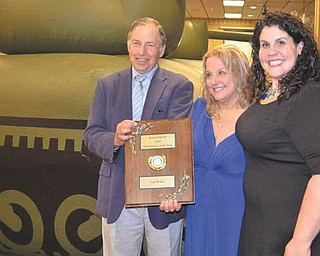 SPECIAL TO THE VINDICATOR
New Castle Rotary Club 89 gave its 2015 Entrepreneur of the Year award to Toni McKay on May 17 at the Villa Banquet Center. McKay is an international balloon artist, who owns Starbound Entertainment. She was born and grew up in Ellwood City and moved to New Castle. For information about New Castle Rotary visit its website at www.rotary89.org or visit Facebook. Above, from left, are Dale Perelman, Toni McKay and Aimee McKay.