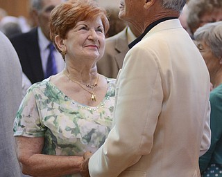 Katie Rickman | The Vindicator.Annette Weidner smiles up at her husband Ralph after renewing their vows after 56 years of marriage during the Wedding Anniversary Mass at St. Columba Cathedral in Youngstown.