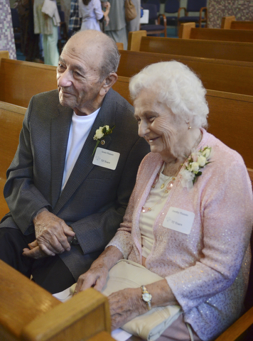 Katie Rickman | The Vindicator.Louis Pizzuto and his wife Dorothy smile as they talk to media after renewing their vows after 70 years of marriage during the Wedding Anniversary Mass at St. Columba Cathedral in Youngstown.