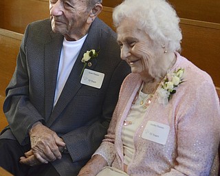 Katie Rickman | The Vindicator.Louis Pizzuto and his wife Dorothy smile as they talk to media after renewing their vows after 70 years of marriage during the Wedding Anniversary Mass at St. Columba Cathedral in Youngstown.