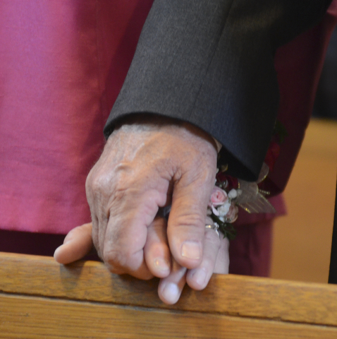 Katie Rickman | The Vindicator.A couple holds hands during the Wedding Anniversary Mass at St. Columba Cathedral in Youngstown.