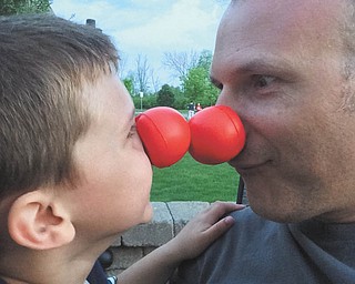 Mark Eskay and son, Evan, both of Hilliard, Ohio, are clowning around.