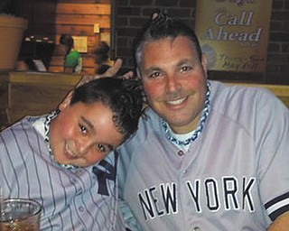 "My dad Tom Tsarnas is special to me because he is always there for me," says Logan Tsarnas. "He coaches my baseball team, cooks me big breakfasts, and takes me for guys nights out. I love him very much. We live in Poland." Sent by Heather Tsarnas.