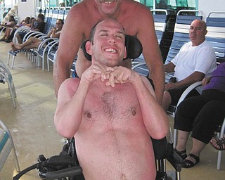 Carl Vadjunec is the father of Michael Vadjunec, who was born with cerebral palsy. Michael says his dad has taken care of him for 40 years. He always puts Michael first and Michael appreciates and loves him for that. This photo was taken on a Carribean Cruise-what a fun time!