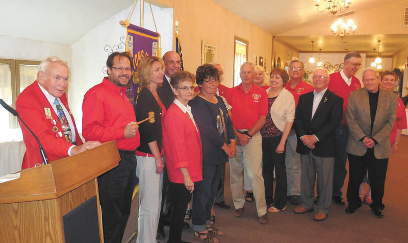 SPECIAL TO THE VINDICATOR
Canfield Lions Club recently met for an awards ceremony and installation of officers. Above, from left are Past District Governor Ted Filmer, who installed officers; incoming President Mike Hoffman; President Carmela Abraham; and Lions Caroline Phillips, Joan Filisky, Pete Cannall, Jack Patrick, Marian Zickefoose, John Africa and Jim Duncan. In back are Rich Yager, Mary Ann and Andy Dzuracky and David and Linda Martin.