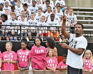 Jeff Lange | The Vindicator  JUNE 20, 2015 - Brad Smith (right) Chaney grad and current free agent in the NFL introduces the children to the coaches prior to the start of his 8th annual football camp held at Stambaugh Stadium in Youngstown.