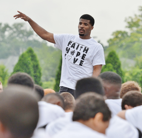 Jeff Lange | The Vindicator  JUNE 20, 2015 - Chaney grad and current NFL free agent Brad Smith speaks to the children in between drills at his 8th annual football camp at Stambaugh Stadium in Youngstown, Saturday morning.