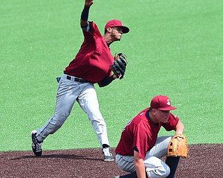 MORGANTOWN, WEST VIRGINIA - JUNE 21, 2015: Short stop Willi Castro #2 of the Scrappers throws the ball over  Nathan Winfrey #10 to first for the 1st out in the bottom of the 5th inning during game one of Sunday afternoons double header at game at Monongalia County Ballpark. DAVID DERMER | THE VINDICATOR