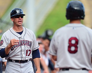 MORGANTOWN, WEST VIRGINIA - JUNE 21, 2015: Manager Travis Fryman #17 of the Scrappers gives instructions to batter Connor Marabell #8 in the on deck circle during game two of Sunday afternoons double header at game at Monongalia County Ballpark. DAVID DERMER | THE VINDICATOR