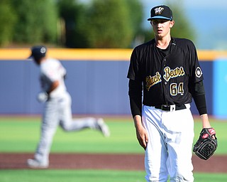 MORGANTOWN, WEST VIRGINIA - JUNE 21, 2015: Pitcher Dovydas Neverauskas #64 of the Black Bears reacts to allowing a solo home run to Anthony Santander #27 of the Scrappers in the top of the 6th inning during game two of Sunday afternoons double header at game at Monongalia County Ballpark. DAVID DERMER | THE VINDICATOR