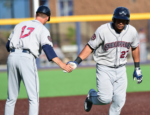 MORGANTOWN, WEST VIRGINIA - JUNE 21, 2015: Anthony Santander #27 of the Scrappers is congratulated by manager Travis Fryman #17 after hitting a solo home run in the top of the 6th inning during game two of Sunday afternoons double header at game at Monongalia County Ballpark. DAVID DERMER | THE VINDICATOR