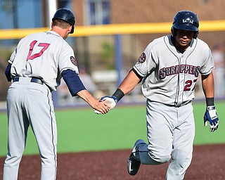 MORGANTOWN, WEST VIRGINIA - JUNE 21, 2015: Anthony Santander #27 of the Scrappers is congratulated by manager Travis Fryman #17 after hitting a solo home run in the top of the 6th inning during game two of Sunday afternoons double header at game at Monongalia County Ballpark. DAVID DERMER | THE VINDICATOR