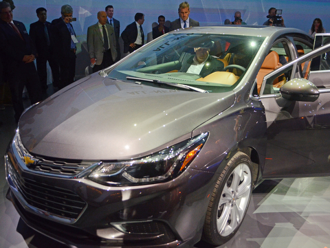 Katie Rickman | The Vindicator.A man sits in the passenger seat of the 2016 Cruze after its unveiling at a global media in Detroit, Michigan on June 24, 2015. Hundreds of people flocked to the stage at the end of the presentation to check out the features of the vehicles.