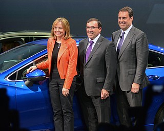 Katie Rickman | The Vindicator.L-R.Mary Barra Chief Executive Officer GM, Alan Batey Executive Vice President and President, North America Alan Batey, and Mark Reuss Executive Vice President, Global Production Development, Purchasing and Supply Chain GM stand near the newly unveiled 2016 Cruze after its unveiling in Detroit Michigan June 24, 2015.