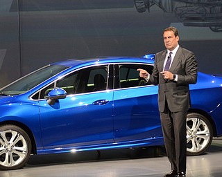 Mark Reuss Executive Vice President, Global Production Development, Purchasing and Supply Chain GM stand near the newly unveiled 2016 Cruze after its unveiling in Detroit Michigan June 24, 2015.