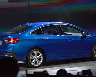 Katie Rickman | The Vindicator.The 2016 Cruze spins on display after its unveiling in Detroit Michigan June 24, 2015 while hundreds of global media attend the unveiling.