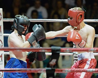 Jeff Lange | The Vindicator  JUNE 24, 2015 - Howland's Ryan Croyle (right) delivers a punch to opponent Brian Shina of Fitch during their junior welterweight match, Wednesday evening in North Lima.