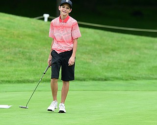 HUBBARD, OHIO - JUNE 26, 2015: Dean Austalosh of Campbell smiles in frustration after missing a putt on the 13th hole Friday afternoon at Pine Lakes during a Vindy Greatest Golfer qualifying Tournament. DAVID DERMER | THE VINDICATOR