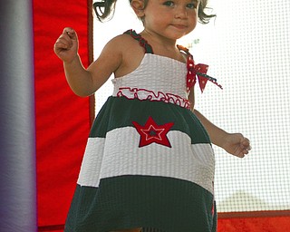 Katie Rickman | The Vindicator.Eva Lemke 1 jumps in the bounce house at the Austintown Fireworks Celebration July 3, 2015.