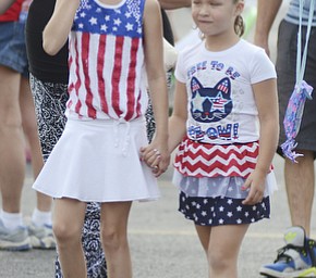 Katie Rickman | The Vindicator.Tatum Thomas 10 of Youngstown on left holds hands with her cousin Addicson Marker 5 also of Youngstown at the Austintown Fireworks Celebration July 3, 2015.