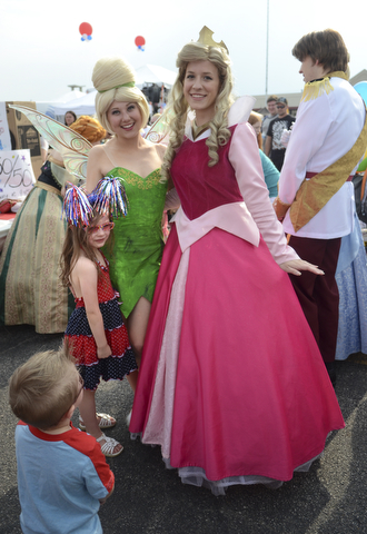 Katie Rickman | The Vindicator.Ava Lombardo 5 of Austintown smiles as she excited poses with Disney characters, her brother A.J. 2 stands nearby at the Austintown Fireworks Celebration July 3, 2015.