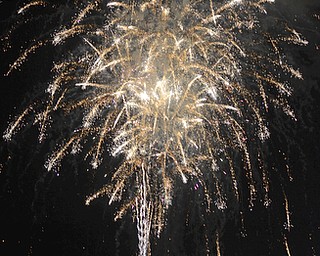 Katie Rickman | The Vindicator.Local families enjoy fireworks downtown Youngstown on July 3, 2015.  Cars lined Vindicator Sq., Front Street, the Market Street Bridge and many roads leading towards the Covelli Centre where the fireworks were set off.