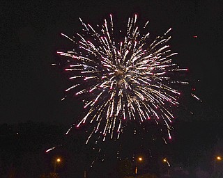 Katie Rickman | The Vindicator.Local families enjoy fireworks downtown Youngstown on July 3, 2015.  Cars lined Vindicator Sq., Front Street, the Market Street Bridge and many roads leading towards the Covelli Centre where the fireworks were set off.