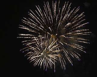 Katie Rickman | The Vindicator.Local families enjoy fireworks downtown Youngstown on July 3, 2015.  Cars lined Vindicator Sq., Front Street, the Market Street Bridge and many roads leading towards the Covelli Centre where the fireworks were set off.