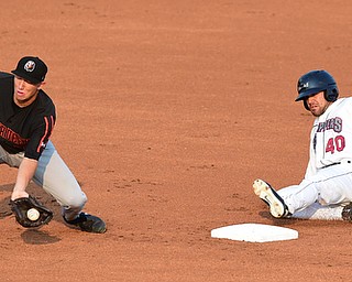 NILES, OHIO - JULY 4, 2015: Ki'ai Tom of the Scrappers slides into second base for a double beating the tag of Drew Turbin #32 of the Ironbirds in the 1st inning of Saturday nights game at Eastwood Field. DAVID DERMER | THE VINDICATOR