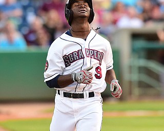 NILES, OHIO - JULY 4, 2015: Silento Sayles #9 of the Scrappers shows his frustration after grounding into a inning ending double play with runners in scoring position in the 4th inning of Saturday nights game at Eastwood Field. DAVID DERMER | THE VINDICATOR