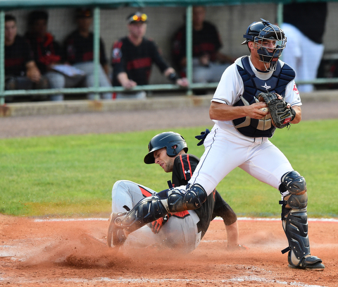 NILES, OHIO - JULY 4, 2015: Base runner Mike Odenwaelder #37 takes out the leg of catcher Daniel Salters #12 of the Scrappers after being forced out at home in the 5th inning of Saturday nights game at Eastwood Field. DAVID DERMER | THE VINDICATOR