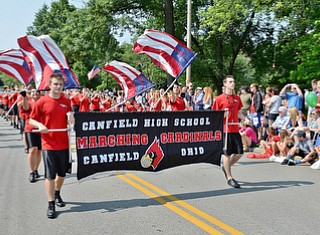 Jeff Lange | The Vindicator  JULY 4, 2015 - The Canfield High School Marching Cardinals perform patriotic tunes as they participate in the 2015 Fourth of July parade at the square in Canfield, Saturday morning.