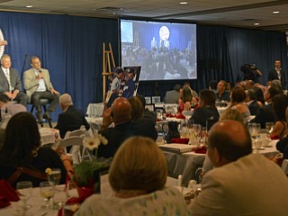 Katie Rickman | The Vindicator.Tom Hamilton radio announcer for the Cleveland Indians, John Hirschbeck, a MLB umpire and Joe Torre former baseball manager speak during the The Magic of Michael benefit dinner at the Lake Club in Poland Sunday July 5, 2015.
