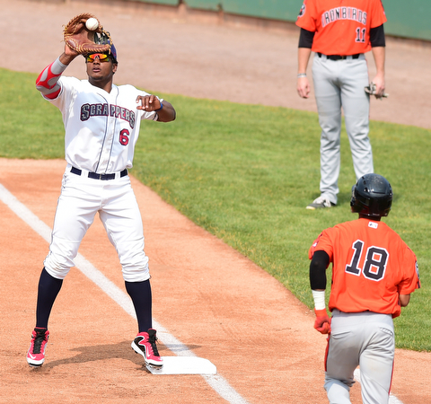 NILES, OHIO - JULY 5, 2015: First basemen Emmanuel Tapia #6 of the Scrappers elevates to catch the ball to force out base runner Ricardo Andujar #18 of the Ironbirds in the 1st inning during Sunday afternoons game at Eastwood Field. DAVID DERMER | THE VINDICATOR