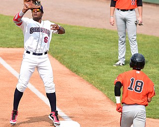 NILES, OHIO - JULY 5, 2015: First basemen Emmanuel Tapia #6 of the Scrappers elevates to catch the ball to force out base runner Ricardo Andujar #18 of the Ironbirds in the 1st inning during Sunday afternoons game at Eastwood Field. DAVID DERMER | THE VINDICATOR
