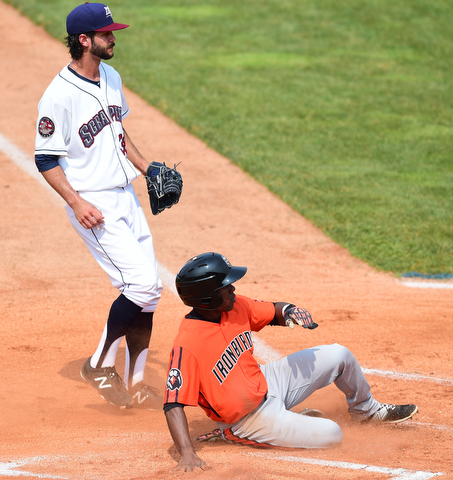 NILES, OHIO - JULY 5, 2015: Cedric Mullins #6 of the Ironbirds slides across home plate to score a run after a wild pitch from Kieran Lovegrove #38 of the Scrappers in the 1st inning during Sunday afternoons game at Eastwood Field. DAVID DERMER | THE VINDICATOR