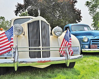 Jeff Lange | The Vindicator  JULY 5, 2015 - A 1939 Packard sports two American flags on it's front bumper to celebrate the 4th of July weekend at the car show in Warren, Sunday afternoon.