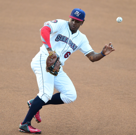 NILES, OHIO - JULY 6, 2015: First basemen Emmanuel Tapia #6 of the Scrappers misplays the baseball allowing it to bounce past him into right field in the 1st inning of Monday nights game at Eastwood Field. DAVID DERMER | THE VINDICATOR