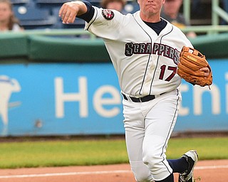 NILES, OHIO - JULY 6, 2015: Third basemen Nate Winfrey #17 of the Scrappers throws the ball to first for the out in the 2nd inning of Monday nights game at Eastwood Field. DAVID DERMER | THE VINDICATOR
