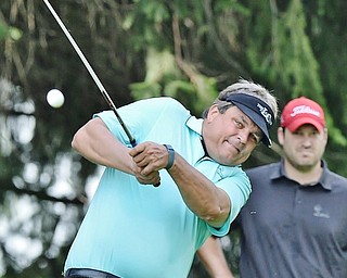 Jeff Lange | The Vindicator  JULY 6, 2015 - Owner of the Lake Club, Ed Muransky watches his shot from the tee during Monday's Magic of Michael Foundation golf outing held at his golf course in Poland.