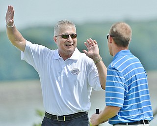Jeff Lange | The Vindicator  JULY 6, 2015 - Major League Baseball umpire John Hirschbeck (left) visited all of the participants of the Magic of Michael Foundation golf outing throughout the day at the Lake Club in Poland Monday afternoon.